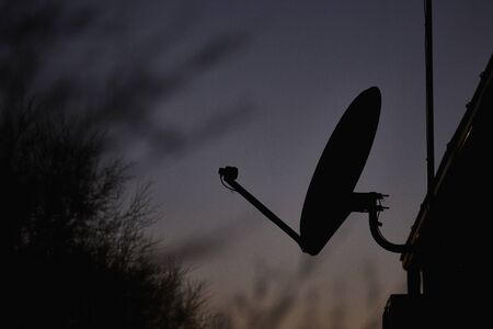 Satellite dish in night at twilightの写真素材