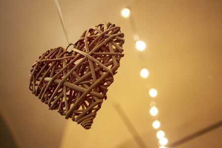 Decorative heart hanging from the ceiling as an embellishment elementの写真素材