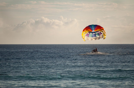 Colorful parachute on the sea at sunset in Bayahibe, Dominican Republic