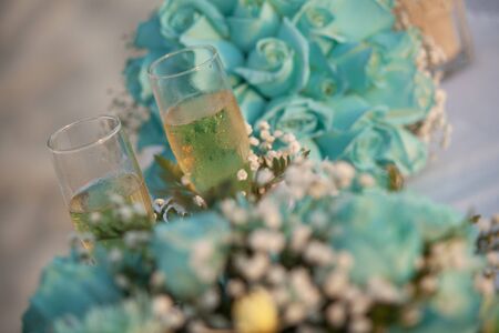 Double toast with champagne at susnet timeの写真素材