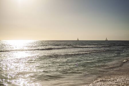 Dominican sunset at sea in Bayahibeの写真素材
