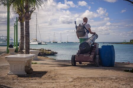 BAYAHIBE, DOMINICAN REPUBLIC 21 JANUARY 2020: Traveler looks at the sea in Bayahibe in the Dominican Republicのeditorial素材