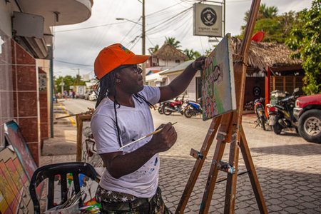 BAYAHIBE, DOMINICAN REPUBLIC 21 JANUARY 2020: Dominican painter street artist in Bayahibeのeditorial素材