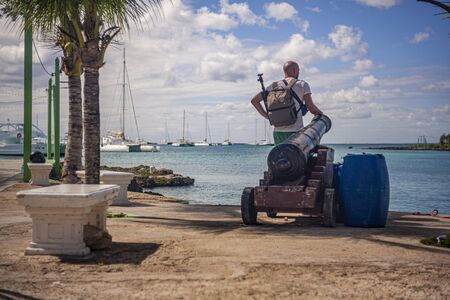 BAYAHIBE, DOMINICAN REPUBLIC 21 JANUARY 2020: Traveler looks at the sea in Bayahibe in the Dominican Republicのeditorial素材