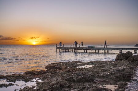 Sunrise on a pier in the sea In Bayahibe, Dominican Republicの写真素材