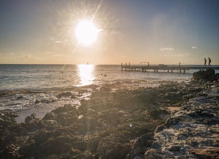 Sunrise on a pier in the sea In Bayahibe, Dominican Republicの写真素材