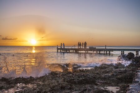 Sunrise on a pier in the sea In Bayahibe, Dominican Republicの写真素材