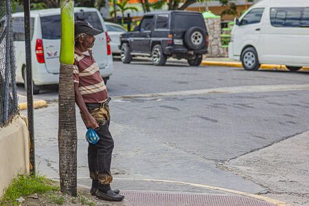 BAYAHIBE, DOMINICAN REPUBLIC 26 JANUARY 2020: Old alcoholic drunkard on the street in Dominican Republicのeditorial素材