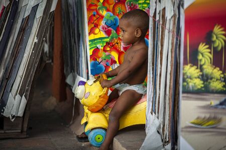 DOMINICUS, DOMINICAN REPUBLIC 6 FEBRAURY 2020: Dominican child plays in the streets of Dominicusのeditorial素材