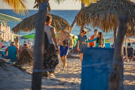 DOMINICUS, DOMINICAN REPUBLIC 6 FEBRAURY 2020: People on Dominicus Beach at sunsetのeditorial素材