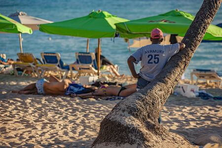 DOMINICUS, DOMINICAN REPUBLIC 6 FEBRAURY 2020: People on Dominicus Beach at sunsetのeditorial素材