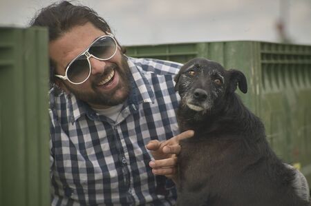 Portrait of a Boy that smiling with his dogのeditorial素材