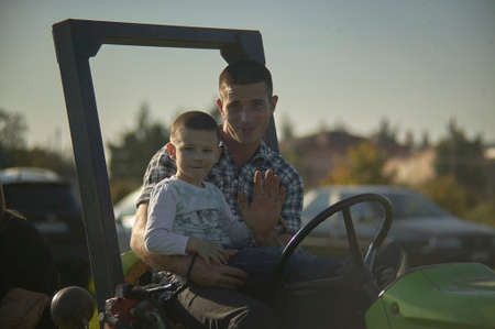 ROVIGO, ITALY 20 FEBRUARY 2020: Dad and baby in daily agricultural lifeのeditorial素材