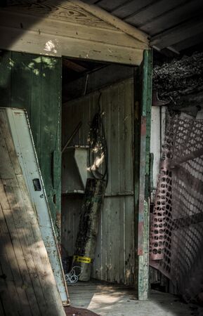 Abandoned maintenance lodge along Po riverの写真素材