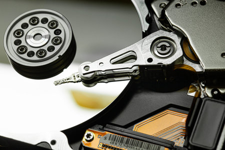 Detail of the inside of a hard disk with the reading head in operation