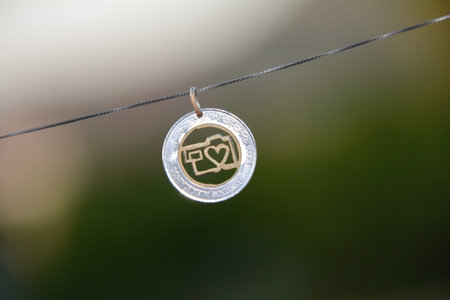 Metal pendant with camera taken in macro lens