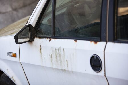 Old abandoned and rusty car exterior detailの写真素材