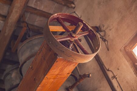 Detail of a vintage industrial machinery in an old building in italyの写真素材