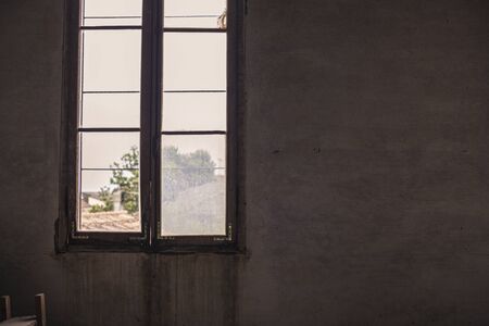 Old, rusty and dirty window detail in an abandoned buildingの写真素材