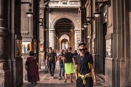 BOLOGNA, ITALY 17 JUNE 2020: People walking under Bologna's Arcades in Italyのeditorial素材