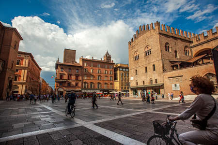 BOLOGNA, ITALY 17 JUNE 2020: Palazzo Re Enzo: a famous historic building in Bologna, Italy with people walking in the squareのeditorial素材