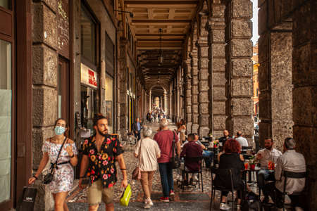 BOLOGNA, ITALY 17 JUNE 2020: People walking under arcades in Bologna, Italyのeditorial素材