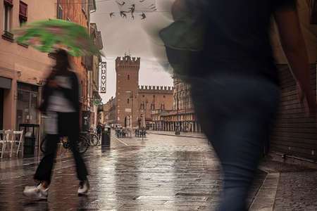 FERRARA, ITALY 29 JULY 2020: Evocative view of the street that leads to Piazza Trento Trieste in Ferrara in Italy with people in their daily livesのeditorial素材