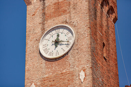 Clock tower or Torre Civica in Italian in Treviso in Italy in a sunny day