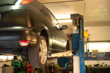 Automobile on overhead crane in the workshop for maintenanceの写真素材
