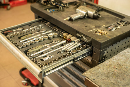 MILAN, ITALY 17 FEBRUARY 2021: Mechanic performs maintenance on the car in the workshop