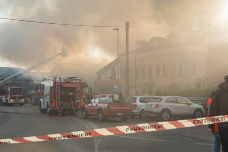 VILLANOVA DEL GHEBBO, ITALY 23 MARCH 2021: House burning at night with firefightersのeditorial素材