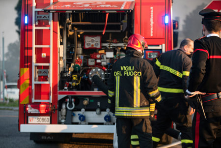 VILLANOVA DEL GHEBBO, ITALY 23 MARCH 2021: House burning at night with firefighters