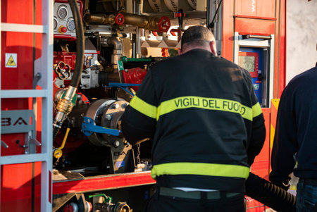 VILLANOVA DEL GHEBBO, ITALY 23 MARCH 2021: Fire on the street with firefighters
