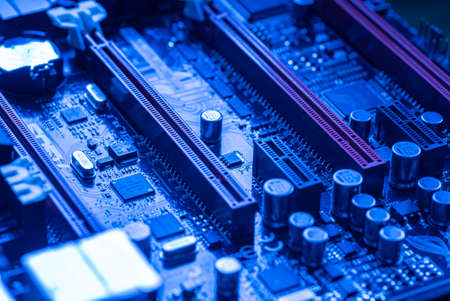 LOS ANGELES, USA 25 APRIL 2021: Pcie slot detail na motherboard of a gaming pc in a blue lightのeditorial素材