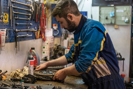 MILAN, ITALY 6 MAY 2021: Mechanic at work in the workshopのeditorial素材