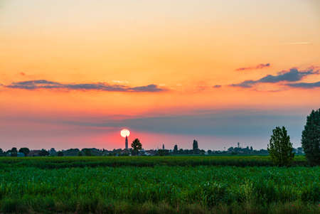 Landscape of Field sunset country city silhouetteの写真素材