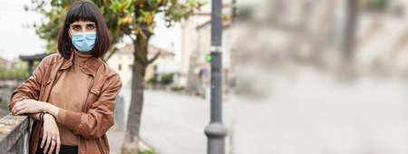 Girl wears mask, banner image with copy spaceの写真素材