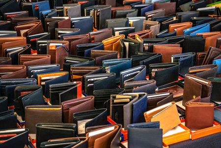 ROVIGO, ITALY 26 OCTOBER 2021: Handcrafted leather wallets for sale in a stand of the italian marketのeditorial素材