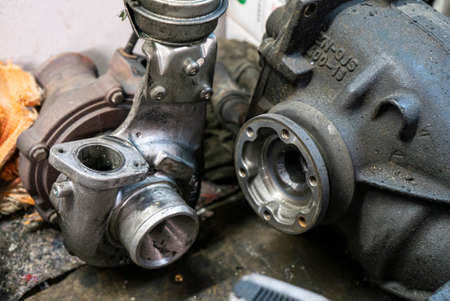 Breakdown of the turbine of the car engine, broken impeller. Old broken car engine turbineの写真素材