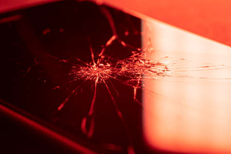 Detail of a broken and cracked smartphone screen. Smart phone with broken screenの写真素材