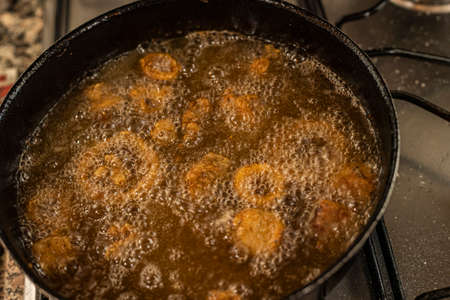 Fish frying in oil. Home made fish fried sceneの写真素材