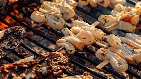 Fish on the grill with smoke cocking scene.の写真素材