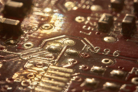electronic background: Internal components of a printed circuit with solders and various components.