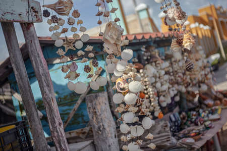 Stand full of dreamcatchers made with shells in a small street of Isla Mujeres in Mexico.の写真素材