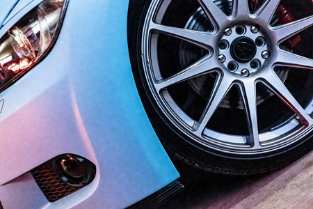 Tuned car rim detail of modern fast sports car. Exclusive tuned car disk close-up. Tuned disk on a sports car for drifting. Lowrider custom stance stylish sports car closeup.の写真素材