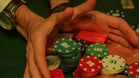 A dramatic moment in a high-stakes poker game as all the chips, or chips, are pushed forward,...