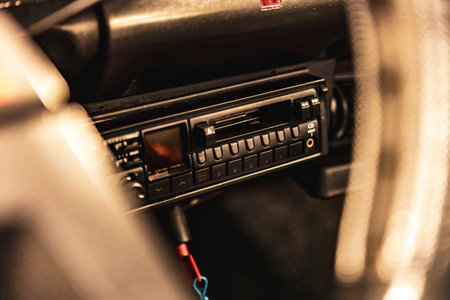 Close-up of a classic car radio with push buttons and tuning dial.の写真素材