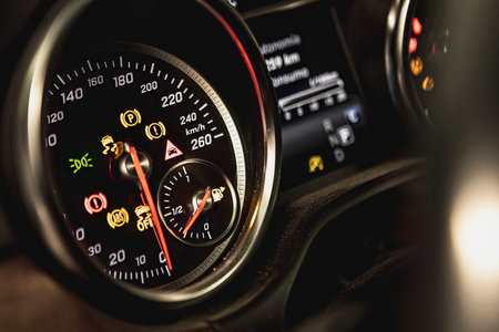 Close-up of a car dashboard with illuminated warning lights indicating a malfunction or fault.の写真素材