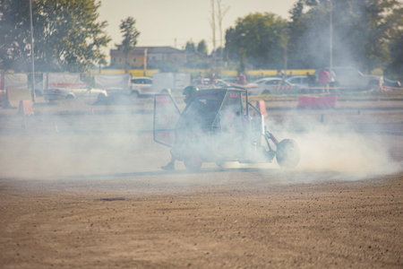 Villamarzana, 10 September 2023: Intense car race capturing the thrill of drifting on a challenging...