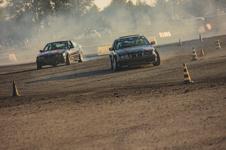 Villamarzana, 10 September 2023: Intense car race capturing the thrill of drifting on a challenging circuit.のeditorial素材